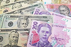 Stack of US Dollar and Ukrainian hryvnia