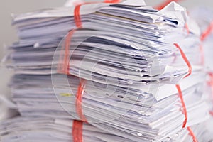 Stack of used paper and old documents packed and ready to be sent out for recycling