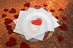 Stack of Valentine`s Day Love Letters on Red Background with Hea