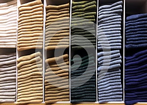 Stack of Various Color Clothes on Shelf