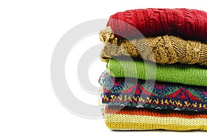 Stack of various sweaters. Winter style