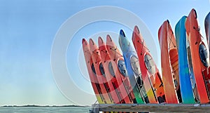 Stack of vertical standing kayaks