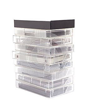 Stack of vintage audio cassettes isolated on white.
