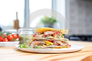 stack of warm tortillas beside a fajita mix ready to serve