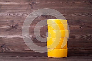 Stack of wax discs on wooden background