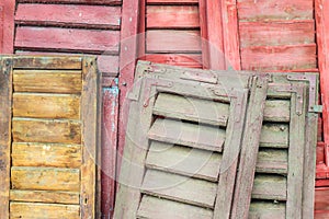 Stack of weathered louver doors
