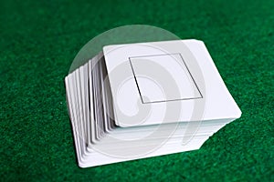 Stack of white cards on the green table