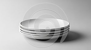 Stack of white ceramic plates on gray background