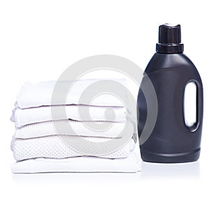 Stack white clothes with black bottle liquid laundry