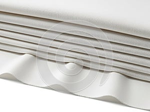 Stack of white fabric sheets isolated on white background