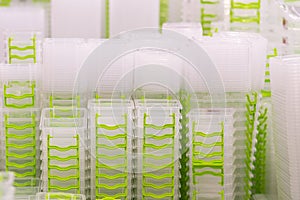 Stack of white food containers in kitchenware store