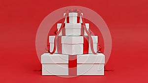 Stack of white gift boxes with red ribbons
