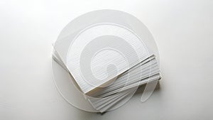 Stack of white lined paper sheets on white surface