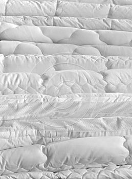 A stack of white new clean duvets in store