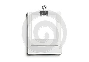 Stack of white paper held by a binder clip isolated on white background
