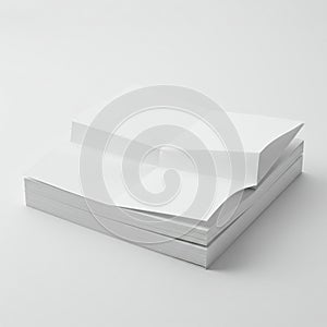 A stack of white paper is neatly arranged on a flat surface. The top sheet is partially
