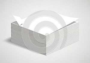 A stack of white paper sheets is neatly arranged, forming a rectangular block