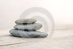 Stack of white pebbles stone against sea background for spa, balance, meditation and zen theme