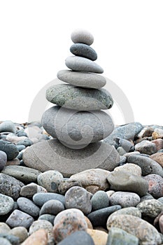 Stack of white pebbles stone on white isolated background for spa, balance, meditation and zen theme