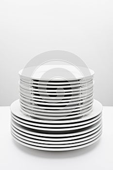 Stack of white plates isolated on white