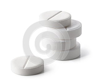 Stack of white round pills or tablets