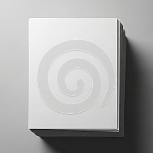 A stack of white sheets of paper is neatly arranged on a flat surface