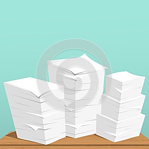 Stack of white sheets and paper in office on brown table top.