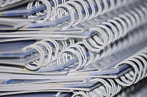 stack of white spiral wire notebooks