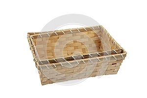 Stack of wicker straw osier handmade baskets different size and pattern at isolated white background for home storage. A set of