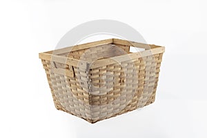 Stack of wicker straw osier handmade baskets different size and pattern at isolated white background for home storage. A set of