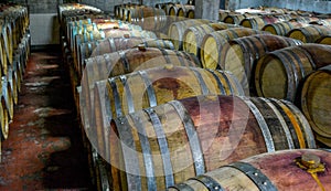 A stack of wine barrels at a vineyard