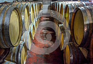 A stack of wine barrels at a vineyard