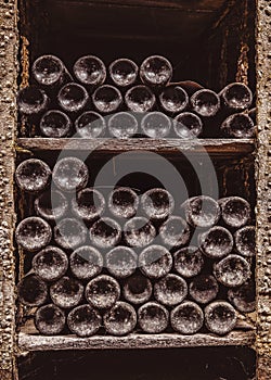 Stack of wine bottles in cellar