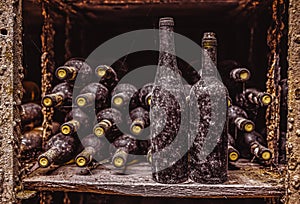Stack of wine bottles in cellar