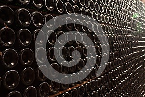Stack of wine bottles in underground in winery