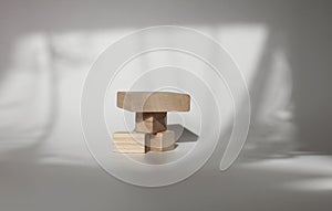 Stack wood cube disc platform podium on white light and shadow copy spase background. Minimal empty display product presentation