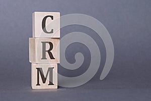 Stack wood letters of CRM abbreviation - Customer Relationship Management