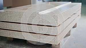 Stack of wood particleboard panels on the warehouse or factory