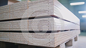 Stack of wood particleboard panels on the warehouse or factory