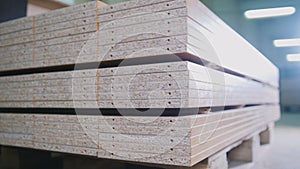 Stack of wood particleboard panels on the warehouse or factory photo