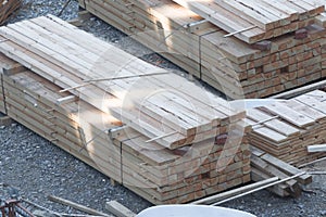 Stack of wooden beams and planks.