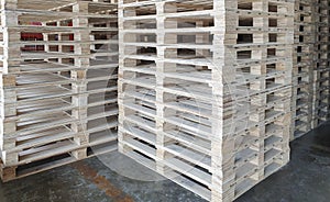 Stack of wooden pallets at industrial warehousing