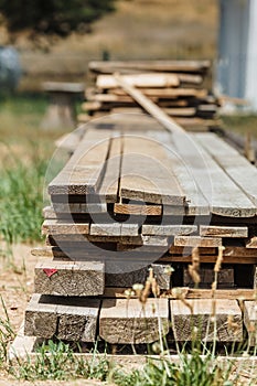 Stack of wooden piles plank boards