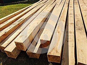 Stack of wooden squared timber for construction