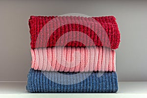 Stack of wool cloth on shelf