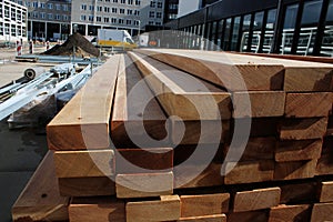 Stack of woorden beams ready to be used for construction work