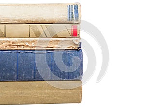 Stack of worn books on white background