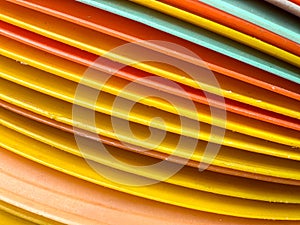 A stack of yellow and orange plates