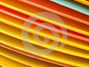 A stack of yellow and orange plates