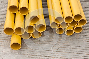 Stack of yellow PVC pipes